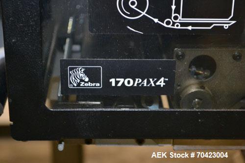 Used Weber Marking Systems Series 5200 Label Printer Applicator Model 5200V2. Label roll size maximum 12" diameter. Includes a Zebra 170 PAX4 print engine. 1/60/115 volt, 5 amp. Mounted on a frame.