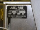Used Label Aire 2111M/LH Print & Apply Labeler with Zebra print head. Model 2111 is a high speed air-blow labeling machine designed for very accurate label placement. The label is retained by vacuum ...