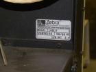 Used Label Aire 2111M/LH Print & Apply Labeler with Zebra print head. Model 2111 is a high speed air-blow labeling machine designed for very accurate label placement. The label is retained by vacuum ...