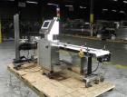 Used Paragon Model PLS-400 Print & Apply Case Labeler. Designed to print barcode and RFID labels. Machine has a 7” Tall label head. Includes automatic belt type case conveyor, integrated on common fr...