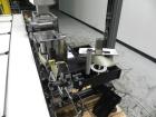 Used Paragon Model PLS-400 Print & Apply Case Labeler. Designed to print barcode and RFID labels. Machine has a 7” Tall label head. Includes automatic belt type case conveyor, integrated on common fr...