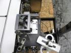 Used Paragon Model PLS-400 Print & Apply Case Labeler. Designed to print barcode and RFID labels. Machine has a 7” Tall label head. Includes automatic belt type case conveyor, integrated on common fr...