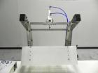 Used Paragon Model PLS-400 Print & Apply Case Labeler. Designed to print barcode and RFID labels. Machine has a 7” Tall label head. Includes automatic belt type case conveyor, integrated on common fr...