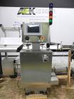 Used Paragon Model PLS-400 Print & Apply Case Labeler. Designed to print barcode and RFID labels. Machine has a 7” Tall label head. Includes automatic belt type case conveyor, integrated on common fr...