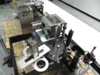Used Paragon Model PLS-400 Print & Apply Case Labeler. Designed to print barcode and RFID labels. Machine has a 7” Tall label head. Includes automatic belt type case conveyor, integrated on common fr...
