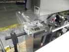 Used Paragon Model PLS-400 Print & Apply Case Labeler. Designed to print barcode and RFID labels. Machine has a 7” Tall label head. Includes automatic belt type case conveyor, integrated on common fr...
