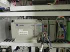 Used Paragon Model PLS-400 Print & Apply Case Labeler. Designed to print barcode and RFID labels. Machine has a 7” Tall label head. Includes automatic belt type case conveyor, integrated on common fr...
