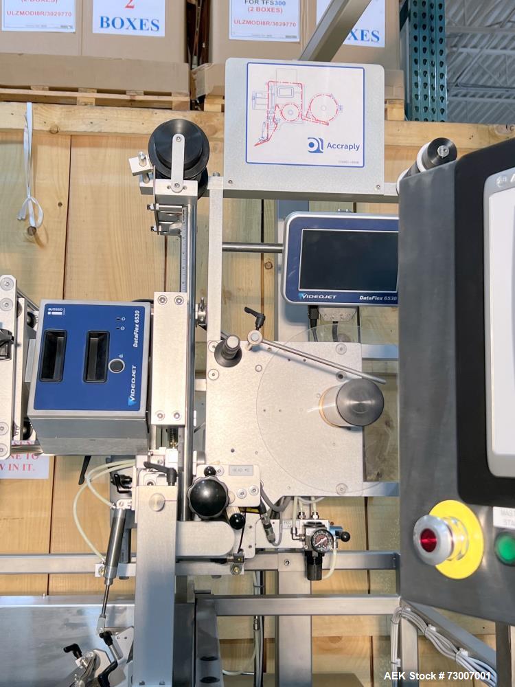 Used Accraply Model 350B-S Series Top and Bottom Labeling System. Capable of up to 120 products per minute depending on application. Special purpose labeling system developed specifically to apply to...