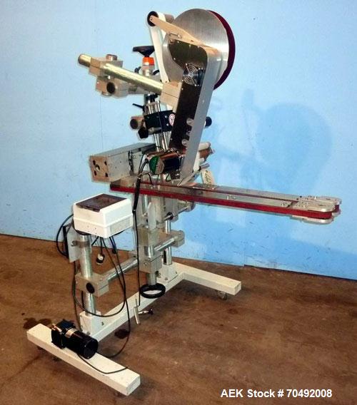 Used CVC Technologies Pressure Sensitive Wipe-On Label Applicator, Model Luca IP65. Up to 5" wide label, 14" label roll diameter with 1-1/2" core.  45"Long x 1" high rubber side carry belts.
