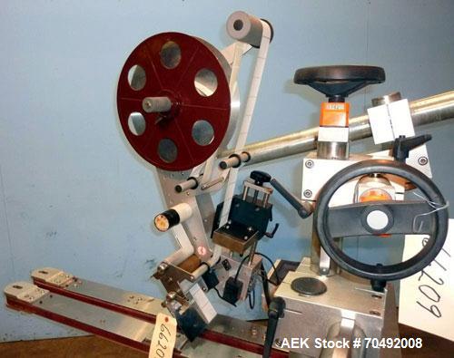 Used CVC Technologies Pressure Sensitive Wipe-On Label Applicator, Model Luca IP65. Up to 5" wide label, 14" label roll diameter with 1-1/2" core.  45"Long x 1" high rubber side carry belts.