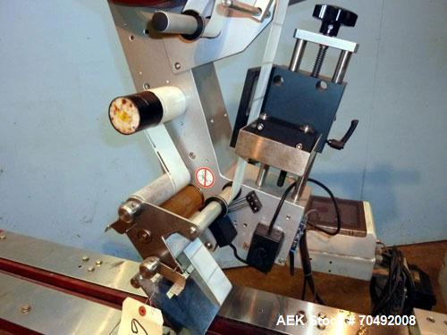 Used CVC Technologies Pressure Sensitive Wipe-On Label Applicator, Model Luca IP65. Up to 5" wide label, 14" label roll diameter with 1-1/2" core.  45"Long x 1" high rubber side carry belts.