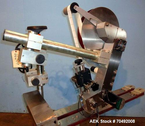 Used CVC Technologies Pressure Sensitive Wipe-On Label Applicator, Model Luca IP65. Up to 5" wide label, 14" label roll diameter with 1-1/2" core.  45"Long x 1" high rubber side carry belts.