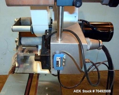 Used CVC Technologies Pressure Sensitive Wipe-On Label Applicator, Model Luca IP65. Up to 5" wide label, 14" label roll diameter with 1-1/2" core.  45"Long x 1" high rubber side carry belts.