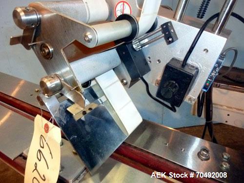 Used CVC Technologies Pressure Sensitive Wipe-On Label Applicator, Model Luca IP65. Up to 5" wide label, 14" label roll diameter with 1-1/2" core.  45"Long x 1" high rubber side carry belts.