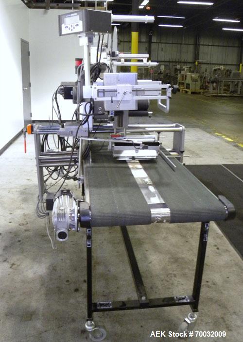 Used Harland Comet Pressure Sensitive Top Labeler, Head unit # 7809. Size range: width 10mm to 205mm, length 10mm to unlimited. Label core reel 76mm, diameter 400mm. Label web speed up to 42 meters/m...