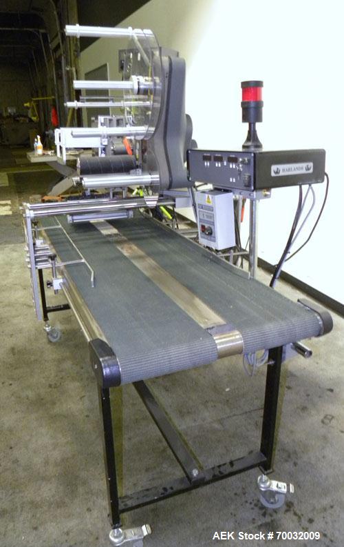 Used Harland Comet Pressure Sensitive Top Labeler, Head unit # 7809. Size range: width 10mm to 205mm, length 10mm to unlimited. Label core reel 76mm, diameter 400mm. Label web speed up to 42 meters/m...