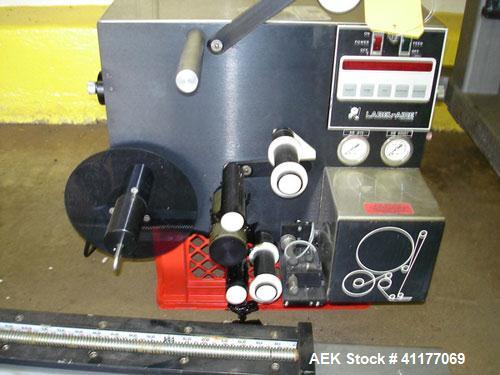 Used Label-Aire Pressure Sensitive Spot Labeler, Model 2111M. Designed for roll fed labels. It is microprocessor controlled and blows the labels on with a blast of air. It will apply labels sized fro...