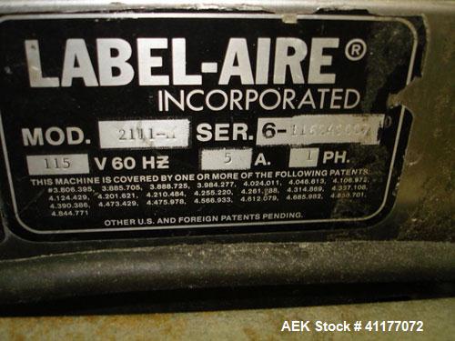 Used Label-Aire Pressure Sensitive Spot Labeler, Model 2111M. Designed for roll fed labels. It is microprocessor controlled and blows the labels on with a blast of air. It will apply labels sized fro...