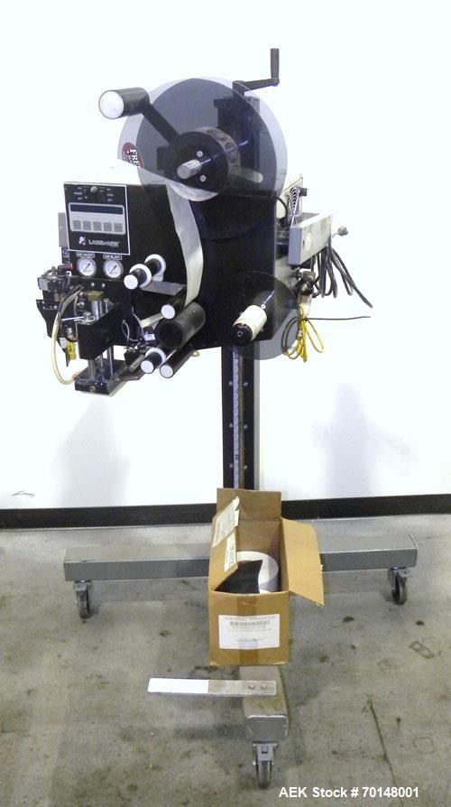 Used Label-Aire Model 2114 CDL High Speed Pressure Sensitive Spot Labeler. Machine is capable of speeds up to 1250 linear inches of web per minute. Has a label size range: length 3/4" to 5.5" or 19mm...