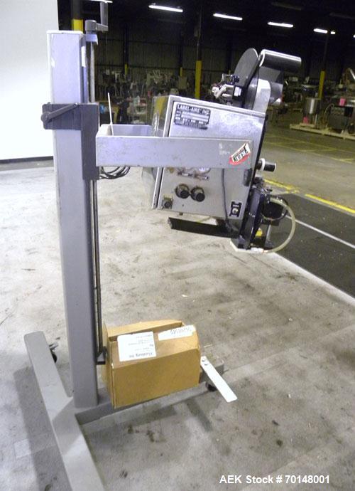 Used Label-Aire Model 2114 CDL High Speed Pressure Sensitive Spot Labeler. Machine is capable of speeds up to 1250 linear inches of web per minute. Has a label size range: length 3/4" to 5.5" or 19mm...
