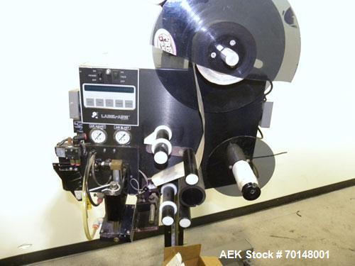 Used Label-Aire Model 2114 CDL High Speed Pressure Sensitive Spot Labeler. Machine is capable of speeds up to 1250 linear inches of web per minute. Has a label size range: length 3/4" to 5.5" or 19mm...