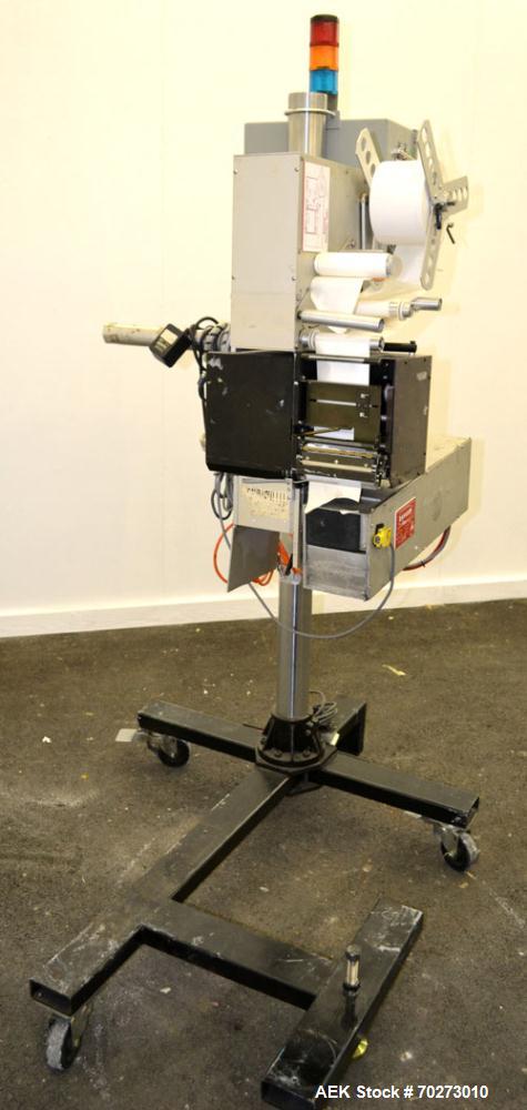 Used Lord Label Systems Print & Apply Portable Pressure Sensitive Labeler. Includes a Sato bar code printer, model M-8400S. Mounted on a stand with casters. Last placing labels on bundles of cartons.