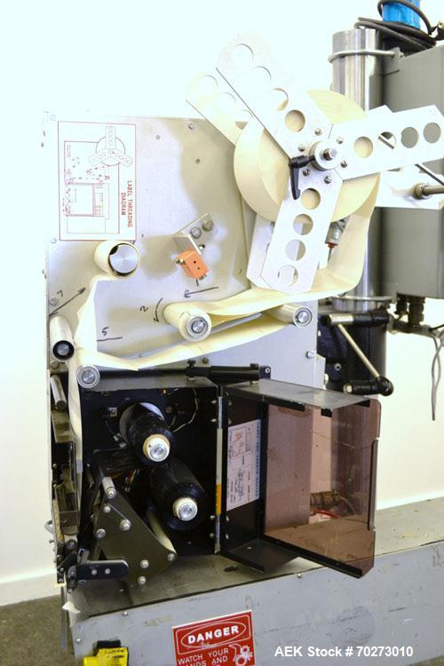 Used Lord Label Systems Print & Apply Portable Pressure Sensitive Labeler. Includes a Sato bar code printer, model M-8400S. Mounted on a stand with casters. Last placing labels on bundles of cartons.
