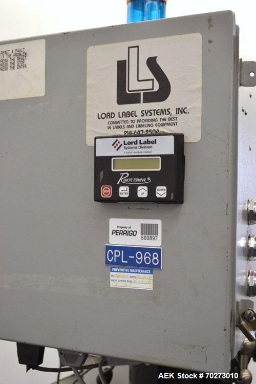 Used Lord Label Systems Print & Apply Portable Pressure Sensitive Labeler. Includes a Sato bar code printer, model M-8400S. Mounted on a stand with casters. Last placing labels on bundles of cartons.