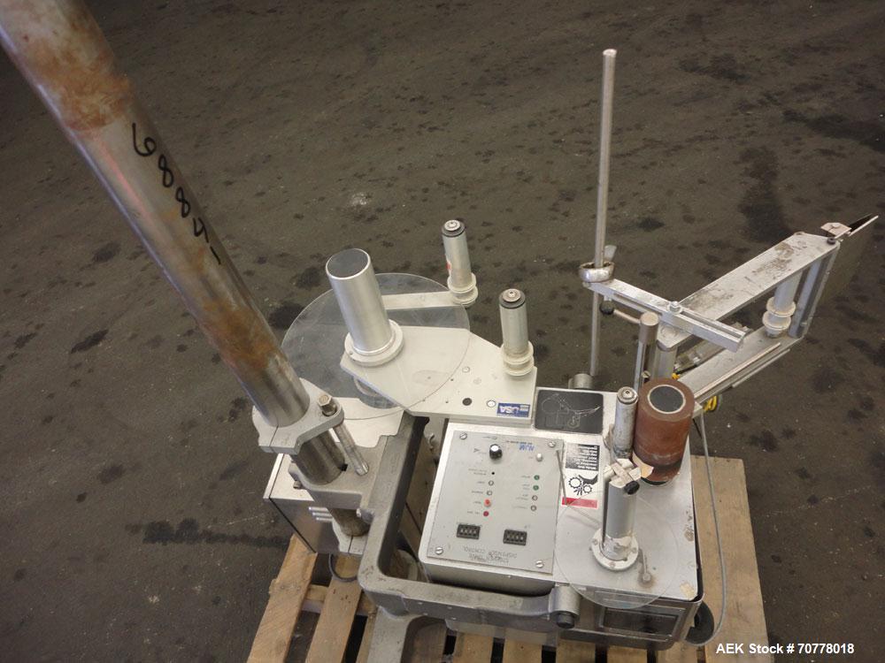 Used New Jersey Machine 305SL Colt Pressure Sensitive Labeler. Machine is rated at speeds of up to 800" of label per minute. Label range minimum 5/8" high x 3/8" long, maximum 5" high x 5" long. Roll...