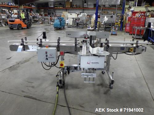 Used Quadrel Model Moduline 3-Panel, Quadrel Q55 L.H. Labeling Head. Adjustable height. 7.5 in. tall plate, currently set up to run 4 in. tall labels, pneumatic flaps for labels. Plastic table-top ch...