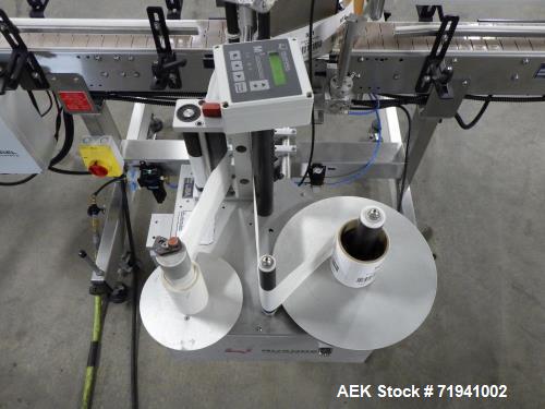 Used Quadrel Model Moduline 3-Panel, Quadrel Q55 L.H. Labeling Head. Adjustable height. 7.5 in. tall plate, currently set up to run 4 in. tall labels, pneumatic flaps for labels. Plastic table-top ch...