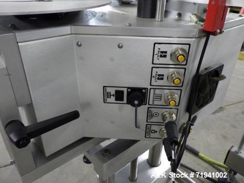 Used Quadrel Model Moduline 3-Panel, Quadrel Q55 L.H. Labeling Head. Adjustable height. 7.5 in. tall plate, currently set up to run 4 in. tall labels, pneumatic flaps for labels. Plastic table-top ch...