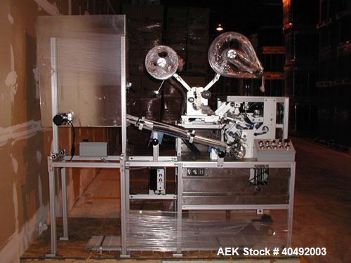 Used Shorewood tube labeler, model 350. Digital applicator head, indexing turret with quick-change mandrels. Capable of applying a wrinkle/bubble free wrap around label or spot labeling to existing p...