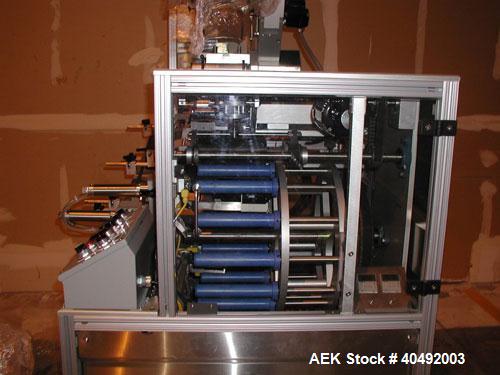 Used Shorewood tube labeler, model 350. Digital applicator head, indexing turret with quick-change mandrels. Capable of applying a wrinkle/bubble free wrap around label or spot labeling to existing p...