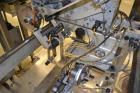 Used Accraply IM2000B bottom pressure sensitive spot labeler. Capable of speeds up to 150 containers per minute. Container size range: (Length) .5