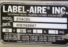Used Label-Aire Model 2114 CDL High Speed Pressure Sensitive Spot Labeler. Machine is capable of speeds up to 1250 linear inches of web per minute. Has a label size range: length 3/4