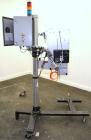 Used Lord Label Systems Print & Apply Portable Pressure Sensitive Labeler. Includes a Sato bar code printer, model M-8400S. Mounted on a stand with casters. Last placing labels on bundles of cartons.