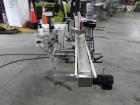 Used Quadrel Model Moduline 3-Panel, Quadrel Q55 L.H. Labeling Head. Adjustable height. 7.5 in. tall plate, currently set up to run 4 in. tall labels, pneumatic flaps for labels. Plastic table-top ch...
