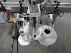 Used Quadrel Model Moduline 3-Panel, Quadrel Q55 L.H. Labeling Head. Adjustable height. 7.5 in. tall plate, currently set up to run 4 in. tall labels, pneumatic flaps for labels. Plastic table-top ch...