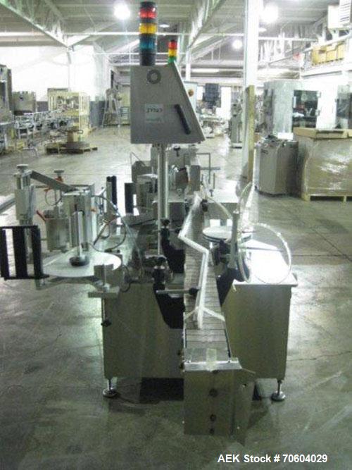 Used One (1) used Aesus wrap around labeler, model Premier Panel 362P, Herma label head, vision system, side bump belts, top hold down belt, reject and controls, 1/60/208 volt,
