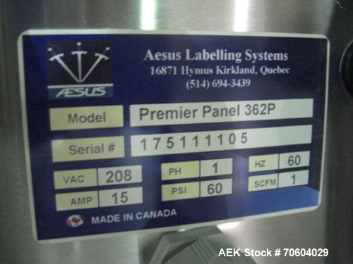 Used One (1) used Aesus wrap around labeler, model Premier Panel 362P, Herma label head, vision system, side bump belts, top hold down belt, reject and controls, 1/60/208 volt,