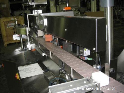 Used One (1) used Aesus wrap around labeler, model Premier Panel 362P, Herma label head, vision system, side bump belts, top hold down belt, reject and controls, 1/60/208 volt,