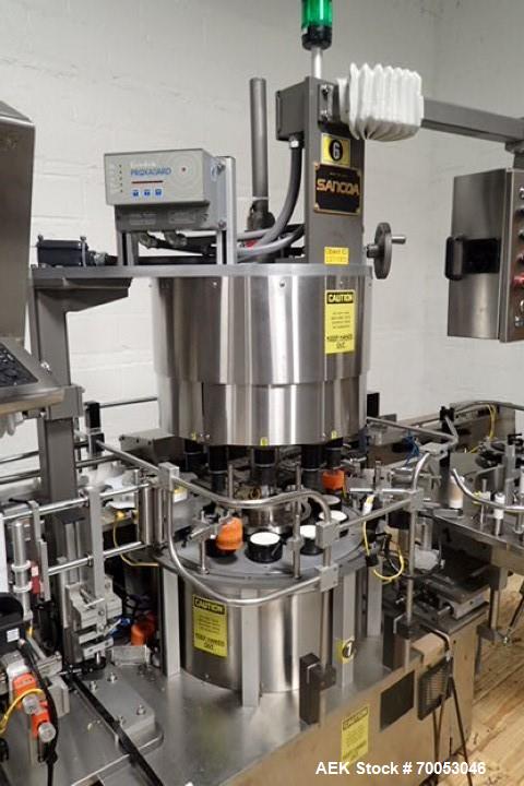Used Used Sancoa rotary labeler. model# PRL 1500R-S10, 10 station, right hand label head, dual label unwind stand, Industrial Dynamic Lastec laser coder with vision system, onboard side serter head, ...