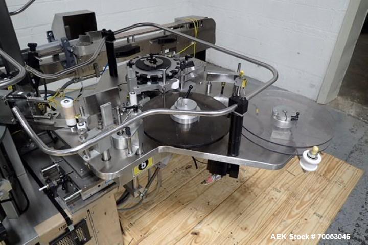 Used Used Sancoa rotary labeler. model# PRL 1500R-S10, 10 station, right hand label head, dual label unwind stand, Industrial Dynamic Lastec laser coder with vision system, onboard side serter head, ...