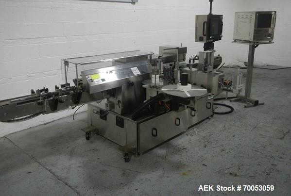 Used-Used New Jersey wrap around labeler, model 334RSTP, speeds up to 400 units/minute, trunion roll bottle handling system,...