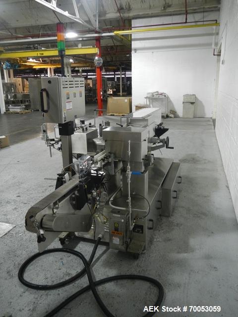 Used Used New Jersey wrap around labeler, model 334RSTP, speeds up to 400 units/minute, trunion roll bottle handling system, Open Date coder, model Printmaster R/H, size range of 1" -14" container he...