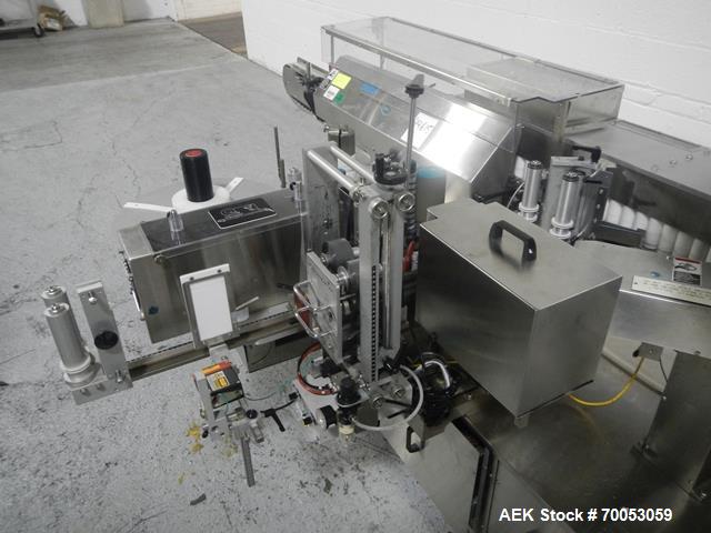 Used-Used New Jersey wrap around labeler, model 334RSTP, speeds up to 400 units/minute, trunion roll bottle handling system,...