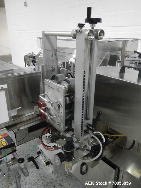 Used-Used New Jersey wrap around labeler, model 334RSTP, speeds up to 400 units/minute, trunion roll bottle handling system,...