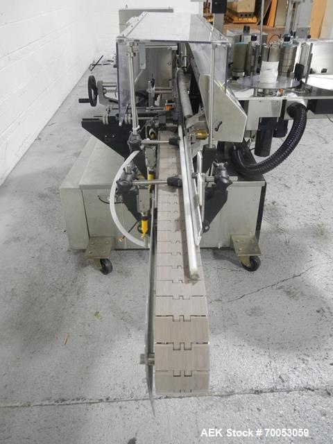 Used-Used New Jersey wrap around labeler, model 334RSTP, speeds up to 400 units/minute, trunion roll bottle handling system,...