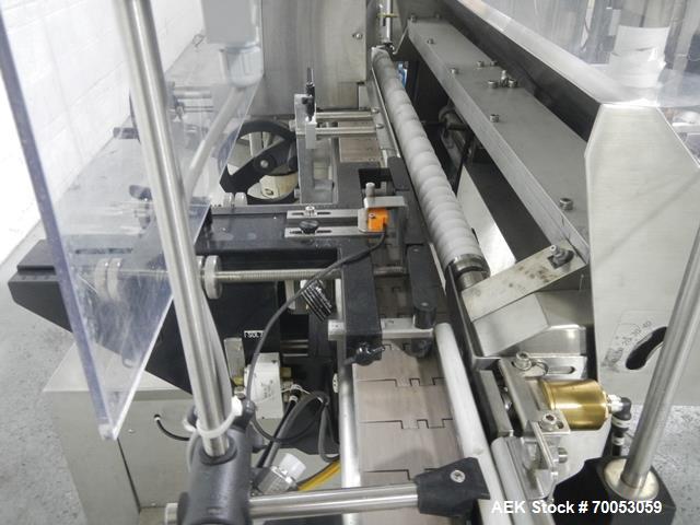 Used Used New Jersey wrap around labeler, model 334RSTP, speeds up to 400 units/minute, trunion roll bottle handling system, Open Date coder, model Printmaster R/H, size range of 1" -14" container he...